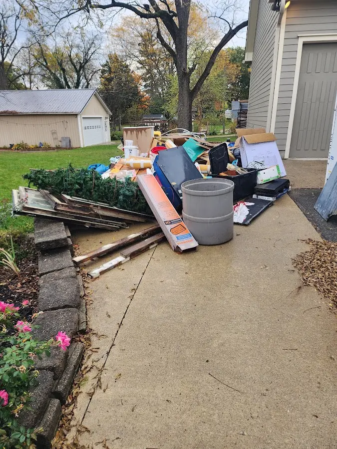 Dumpster being loaded with debris for 3 Yard Dumpster Rental in Glenarden
